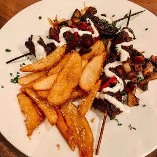 Beef skewers and potato wedges
