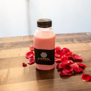 a bottle of milk on a wooden table