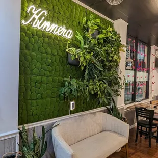 a living room with a green wall