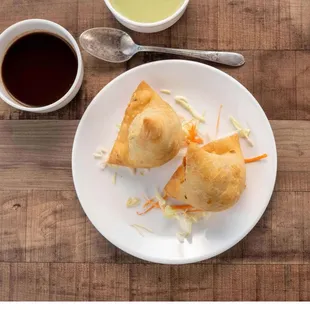 a plate of food and a cup of coffee