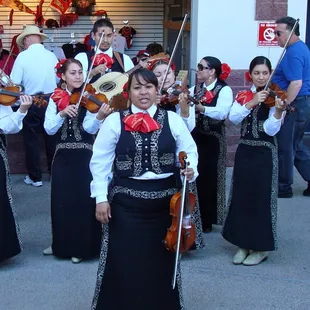 Mariachis strolling around the stadium
