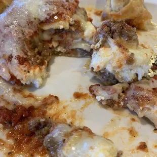 In the middle of eating the 1/2 order lasagna. Mostly Italian sausage in the bolognese sauce. Good stuff!