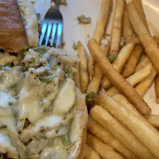 Wife's chicken cheese steak and fries. The sandwich and the fries needed salt, but I know it's my preference. Easily fixed!