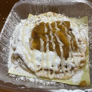 Peach cobbler funnel cake. Normally comes with AMAZING homemade ice cream, but my son is lactose intolerant.