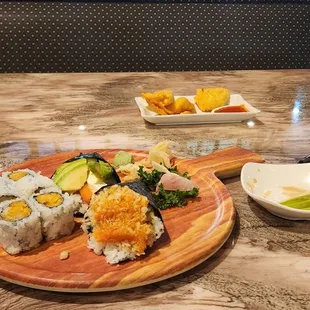 Sushi, sashimi, cheese Rangoons, miso soup, avocado salad