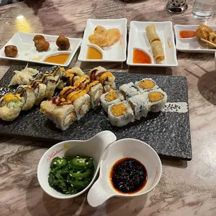 Veggie tempura, spring rolls, cheese rangoons. Nissan and mini cooper roll and spicy yellow tail roll.  Spicy chili oil from the sauce bar