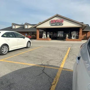 a car parked in front of a restaurant