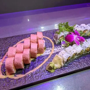 a platter of sushi and rolls