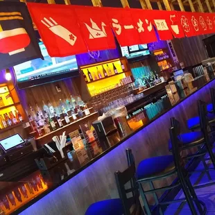 a bar with blue stools