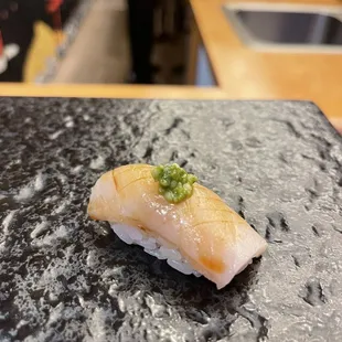 a close up of a piece of sushi