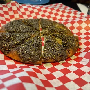 Zaatar Pie (sesame, thyme, sumac, olive oil mix) on bread- pretty good!