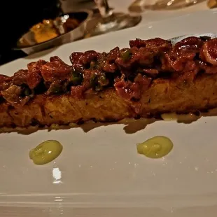 Steak tartare on duck fat tater tot log