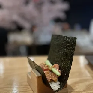 a sushi box on a wooden table