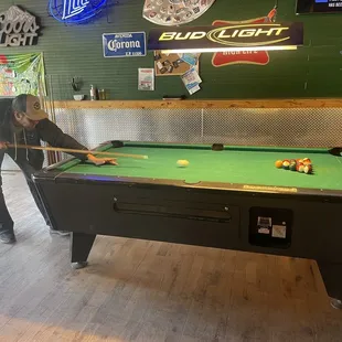 a man playing a game of pool