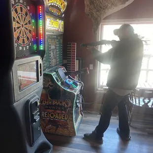 a man playing a game of darts