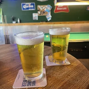 two glasses of beer on a table