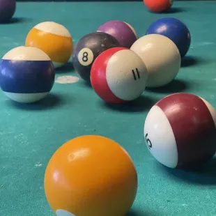 billiard balls on a pool table