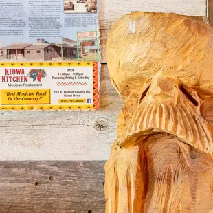 a wood carving of a man