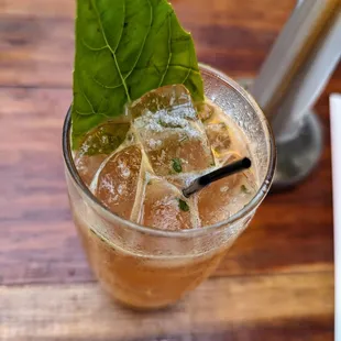 The Manolada. $14. Strawberry-infused rum, fresh lime, basil, and sugar, topped with ginger beer.