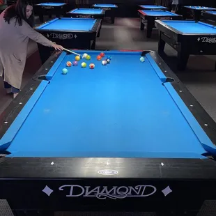 a woman playing pool