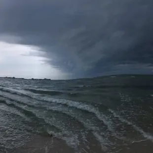 This is a panorama I took on the beach at the park of a storm coming in.