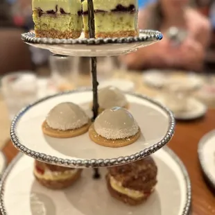 Tea time desserts - pistachio cake, mango mousse and a c strawberry cream puff