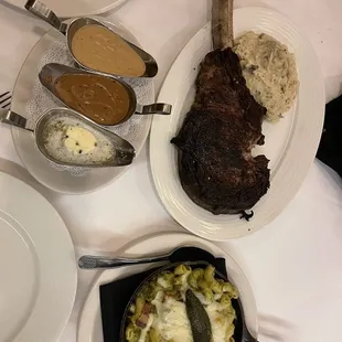 Tomahawk steak with jalapeño Mac and cheese and rosemary mashed potatoes.