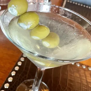 Dry, gin martini with lots of blue cheese olives