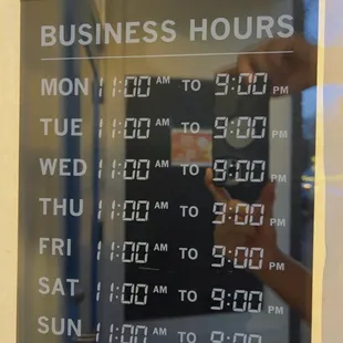 a business hours sign