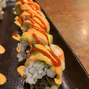 Tsunami Roll - broiled eel &amp; jalapeno roll with shrimp &amp; avocado, topped with spicy mayo &amp; sriracha sauce