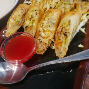 a plate of food and a spoon