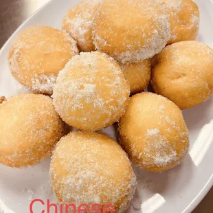 a plate of chinese donuts