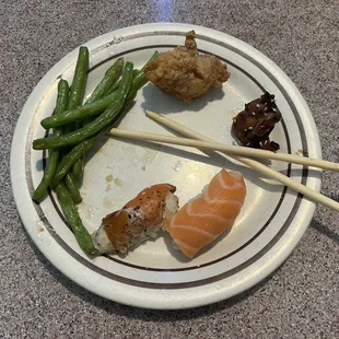 Starting from the left: Green Beans, Chicken Katsu, Teriyaki Chicken, Salmon Nigiri, Pepper Salmon Nigiri.