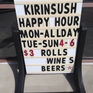 a sign for a happy hour
