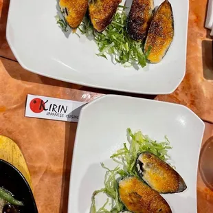 two plates of mussels