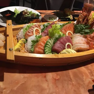 Scallops sushi, fresh salmon, smoked salmon and tuna