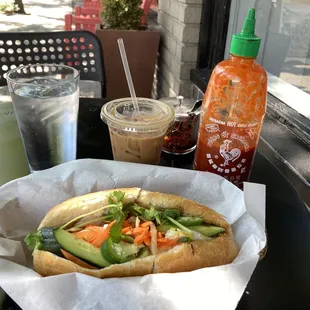 Combo banh mi sandwich with grilled pork, chicken, and fried egg. Nice and fast Vietnamese iced coffee.