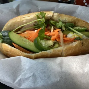 Fantastic combo banh mi sandwich with grilled pork, chicken, and fried egg.