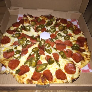 Large Pepperoni and jalapeño pizza with white sauce