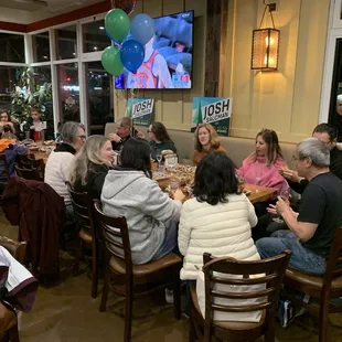 Manager John Paul  and typical family enjoying food