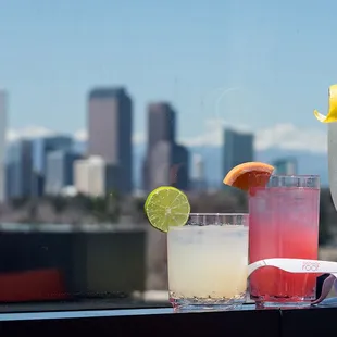 Curated Cocktails with a view of Downtown Denver and the Rocky Mountains