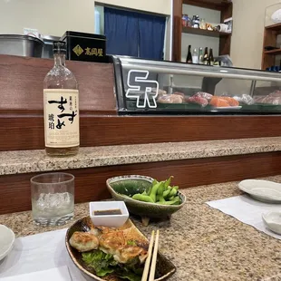 a plate of food on a table with chopsticks