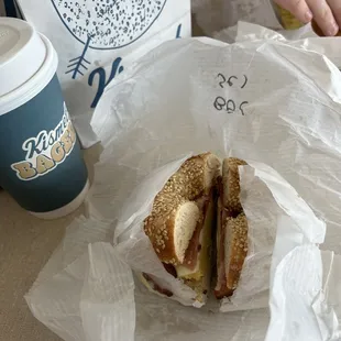 Large latte, and a bacon egg and cheese sammy on sesame