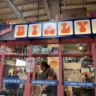 a man standing in front of a store