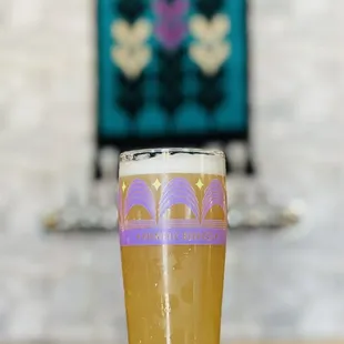 a glass of beer on a table