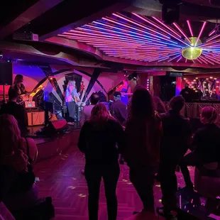 a group of people in a nightclub