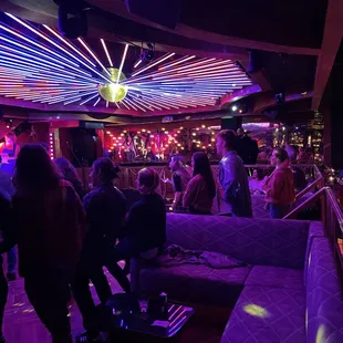 a group of people in a nightclub