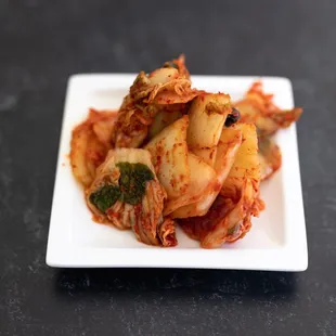a plate of kimchi and shrimp