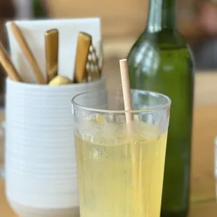 a glass of lemonade on a table