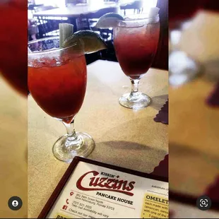 wo glasses of drink on a table